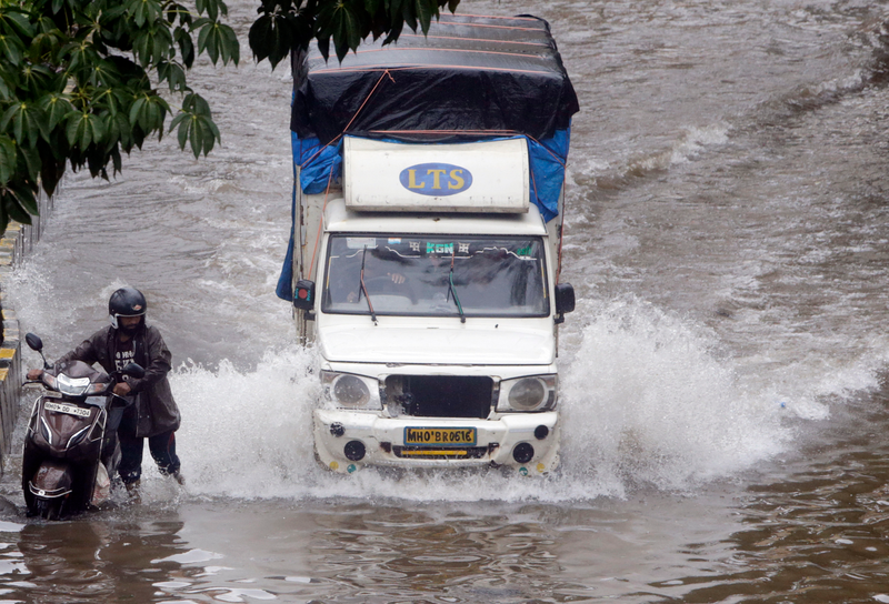Vehicles struggled to make it through the deluge of water on the streets.